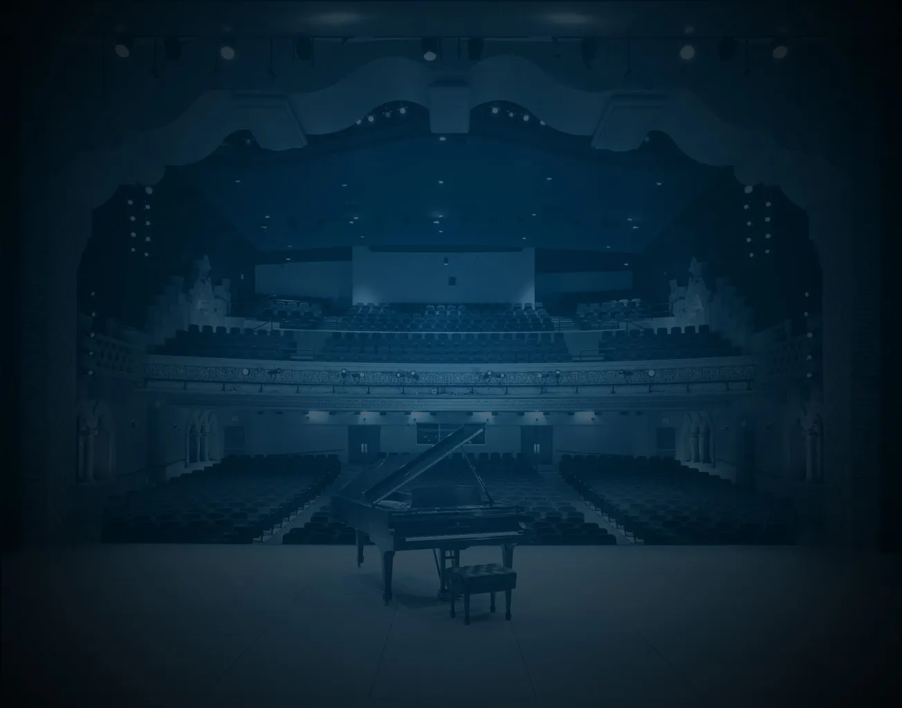 A view from the Lensic House stage with an empty piano